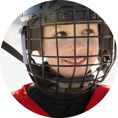 Boy with hockey helmet smiling